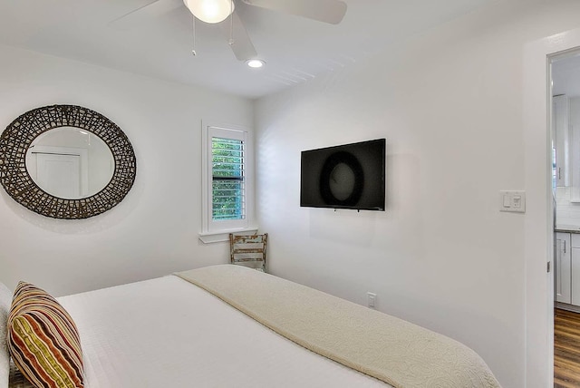 bedroom featuring hardwood / wood-style floors and ceiling fan