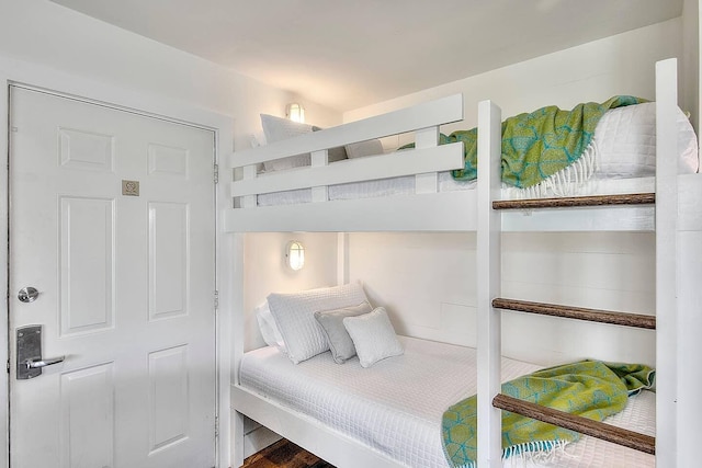 bedroom with wood-type flooring