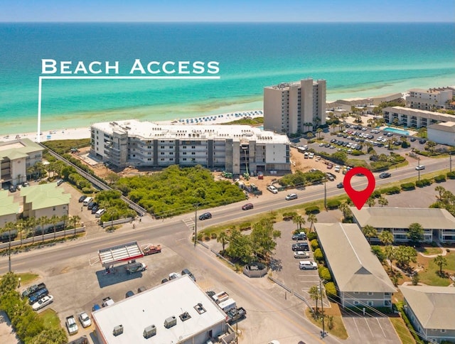 aerial view featuring a water view and a view of the beach