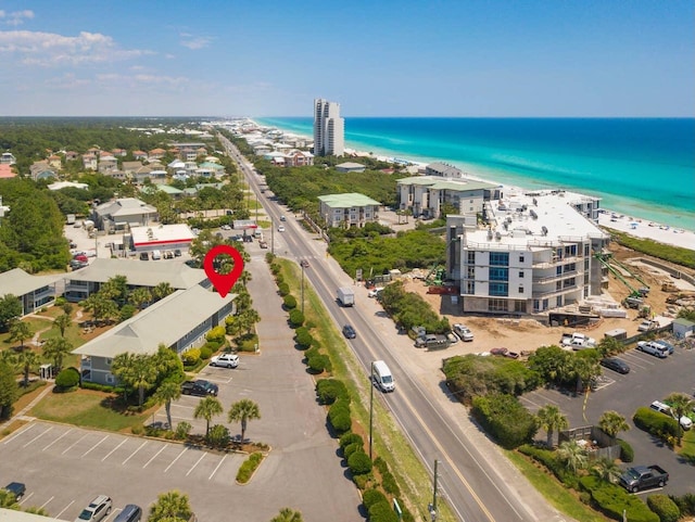 bird's eye view with a water view and a view of the beach