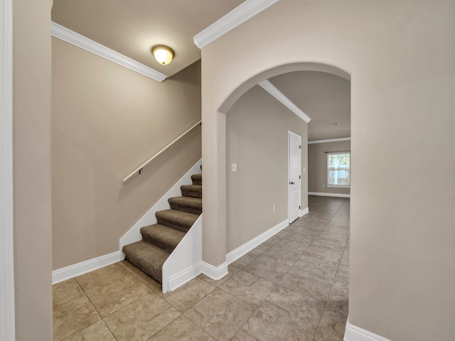 staircase featuring ornamental molding