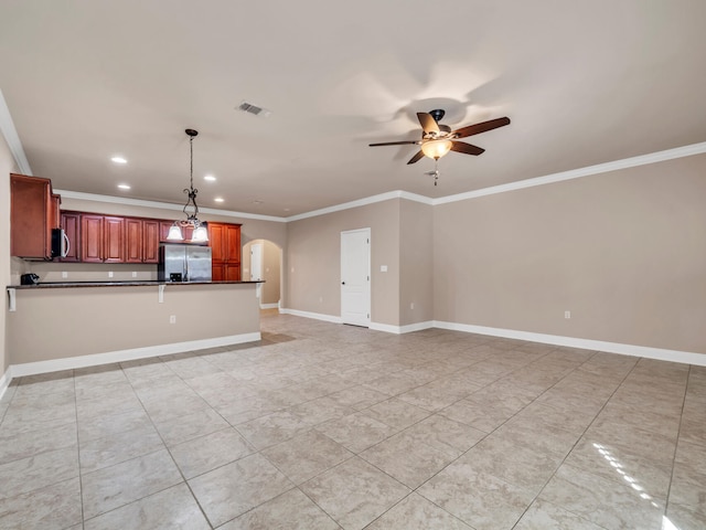 unfurnished living room featuring ceiling fan and crown molding