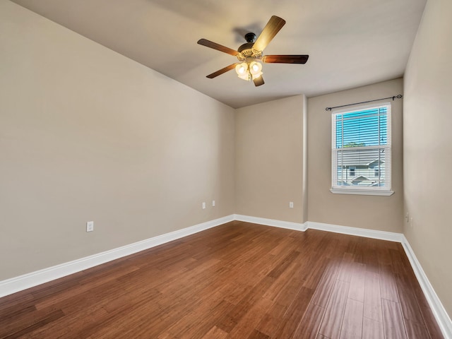 spare room with hardwood / wood-style floors and ceiling fan