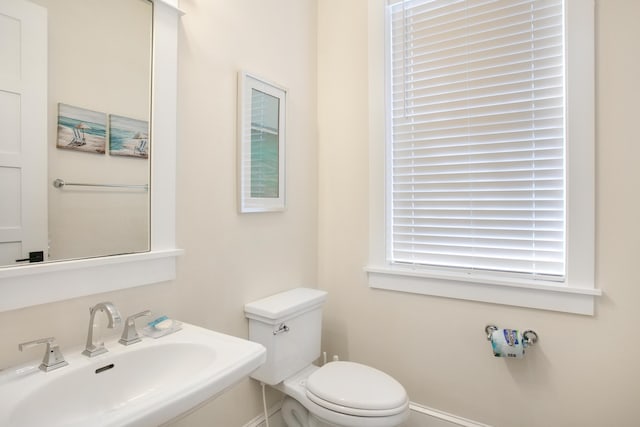 bathroom with toilet and sink