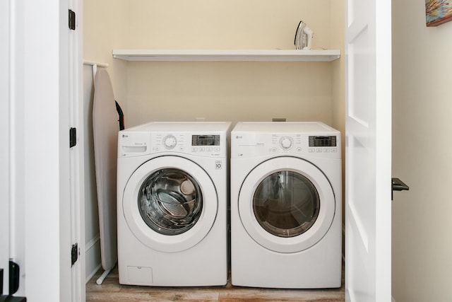 washroom featuring light hardwood / wood-style floors and independent washer and dryer