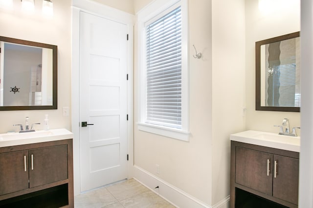 bathroom featuring tile patterned floors and vanity