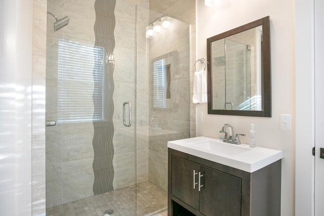 bathroom with vanity and an enclosed shower