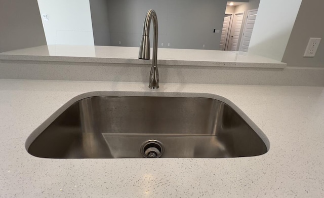 interior details featuring a sink