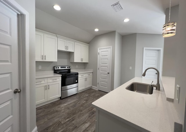 kitchen with dark wood-style floors, stainless steel range with electric cooktop, white cabinetry, a sink, and recessed lighting