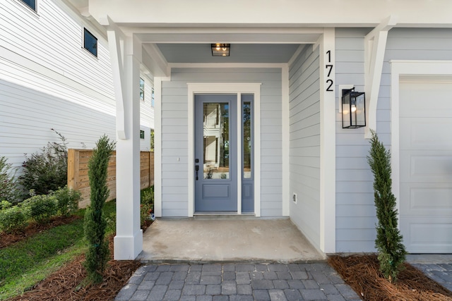 entrance to property featuring a garage