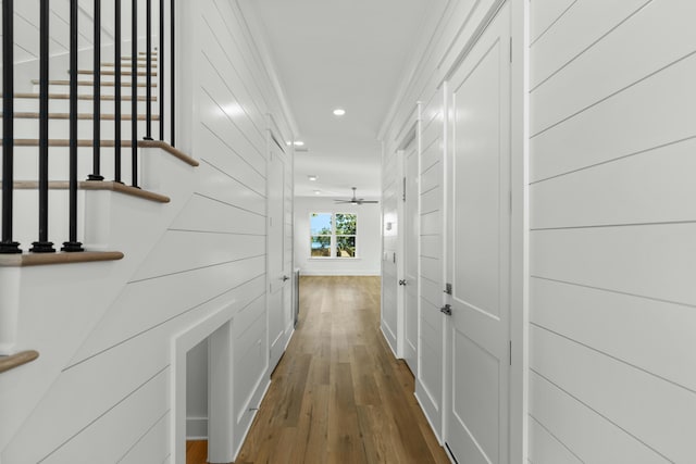 hall featuring hardwood / wood-style floors and ornamental molding