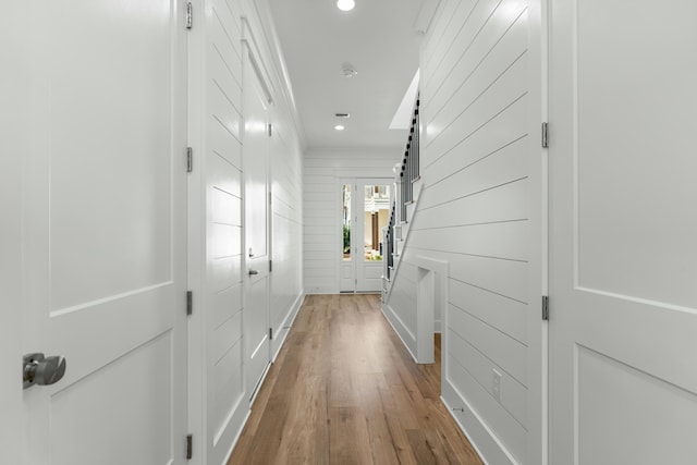 corridor featuring hardwood / wood-style floors