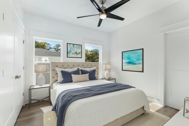 bedroom with ceiling fan and light hardwood / wood-style floors