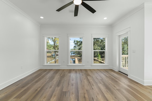 interior space with crown molding, ceiling fan, and wood-type flooring