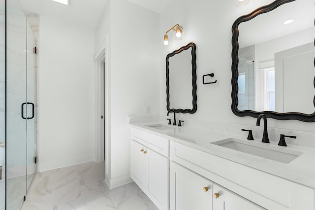 bathroom with a shower with door and vanity