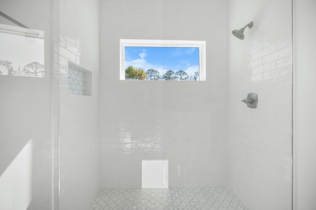 bathroom with a tile shower