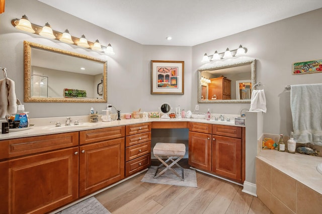 bathroom with hardwood / wood-style flooring and vanity