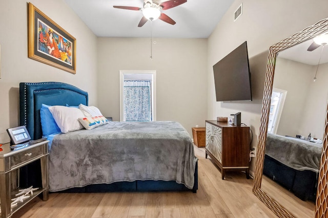 bedroom featuring light hardwood / wood-style flooring and ceiling fan