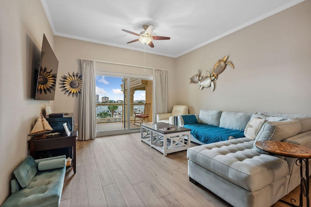 living room featuring crown molding, light hardwood / wood-style flooring, and ceiling fan