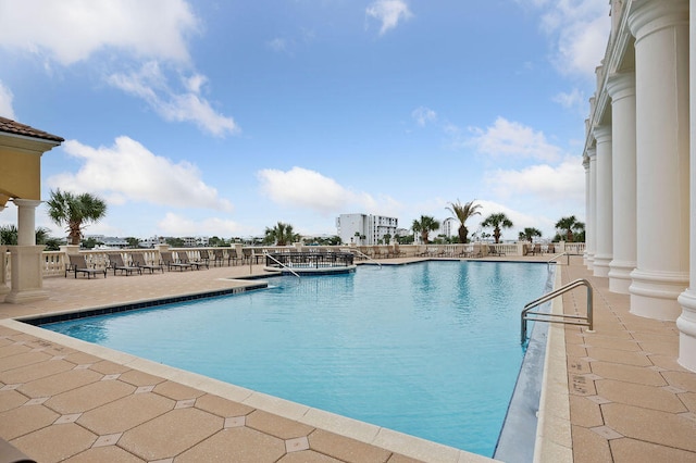 view of swimming pool with a patio