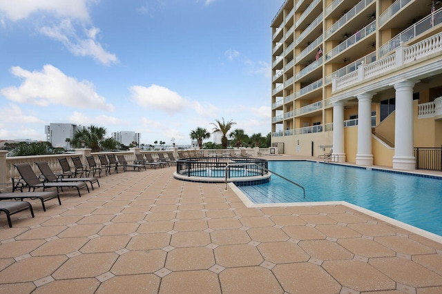 view of swimming pool featuring a patio area