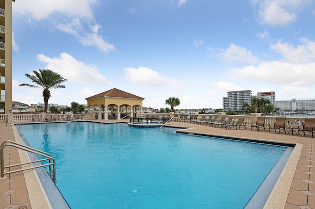 view of swimming pool featuring a patio