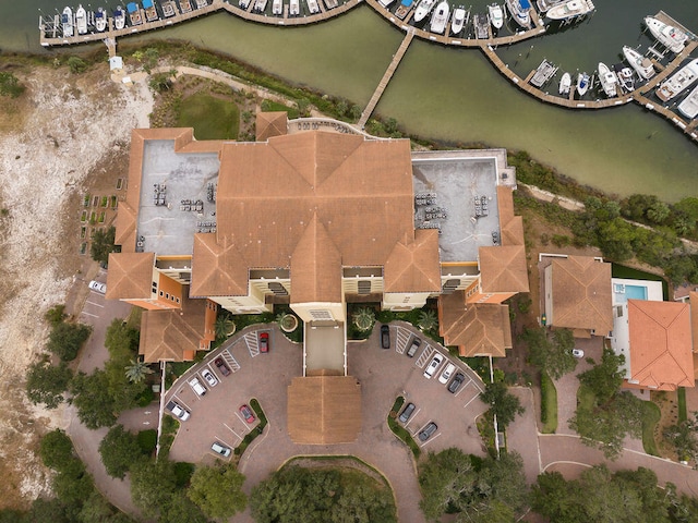 birds eye view of property with a water view