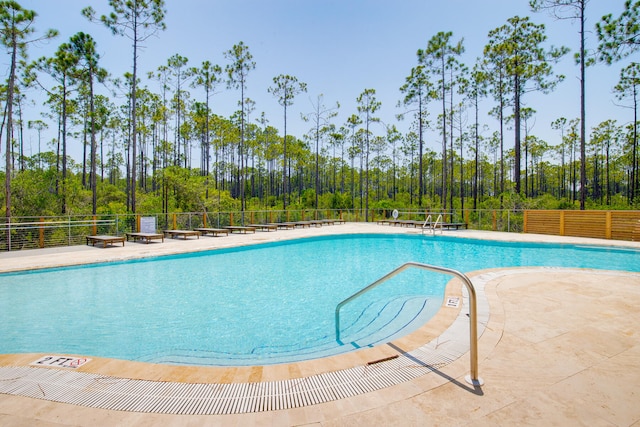 view of swimming pool featuring a patio