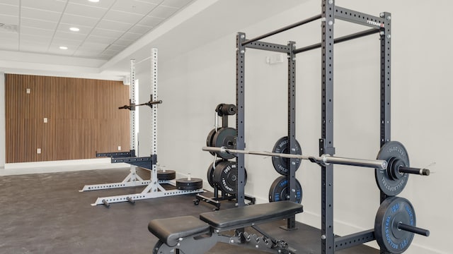 exercise room featuring a drop ceiling