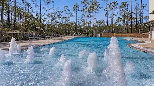 view of swimming pool featuring pool water feature