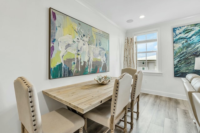 dining space with light wood-type flooring