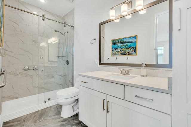 bathroom featuring vanity, toilet, and walk in shower