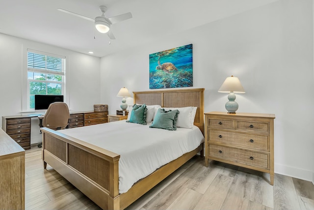 bedroom with ceiling fan and light wood-type flooring