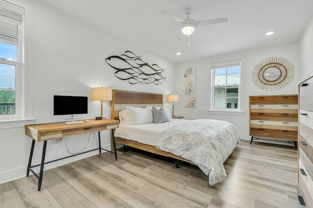 bedroom featuring ceiling fan and light hardwood / wood-style floors