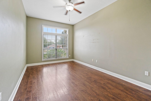 spare room with ceiling fan and wood-type flooring