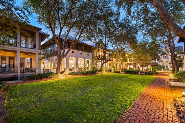 view of yard with a balcony