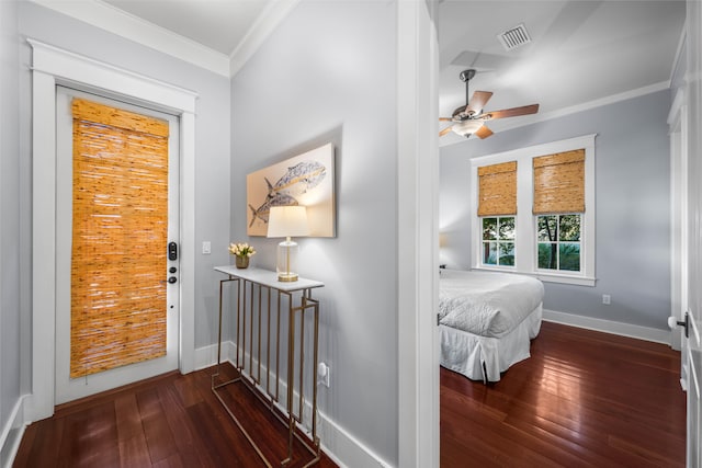 interior space featuring dark wood-type flooring and ornamental molding