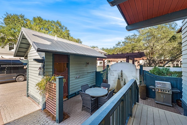 wooden deck featuring grilling area