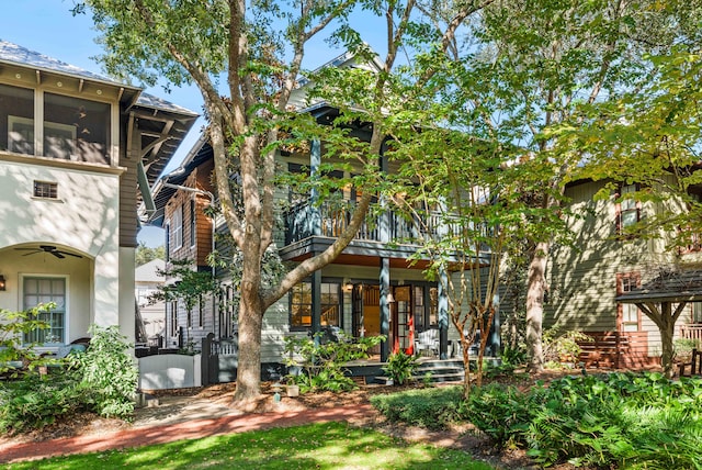 rear view of property with covered porch