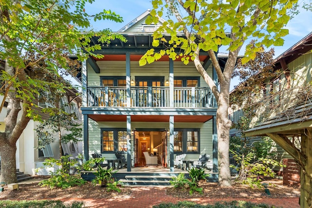 view of front of home featuring covered porch and a balcony