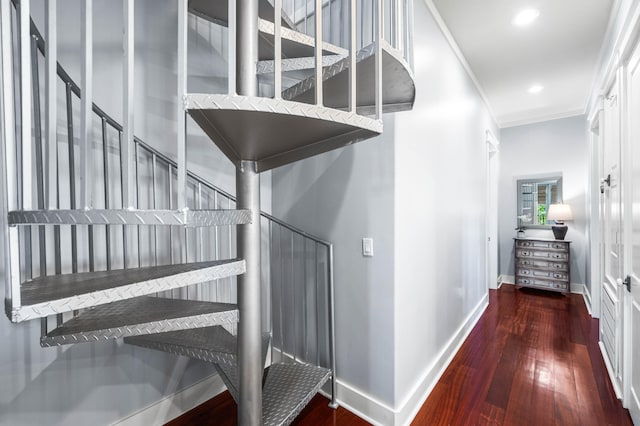 stairway featuring wood-type flooring and ornamental molding