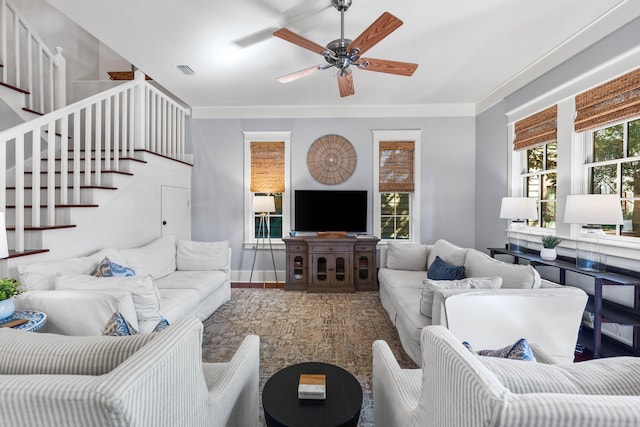 living room with ceiling fan, crown molding, and wood-type flooring