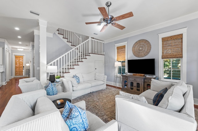 living room featuring ceiling fan and dark wood-type flooring