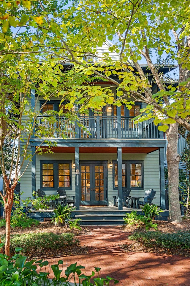 exterior space featuring french doors, a balcony, and a porch