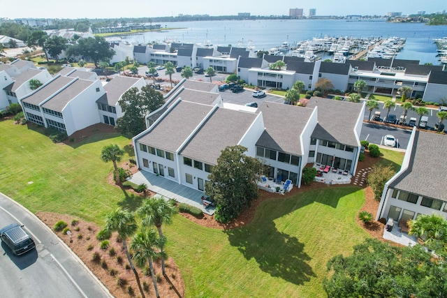 birds eye view of property with a water view