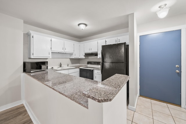 kitchen featuring white cabinetry, kitchen peninsula, electric range, and light stone countertops