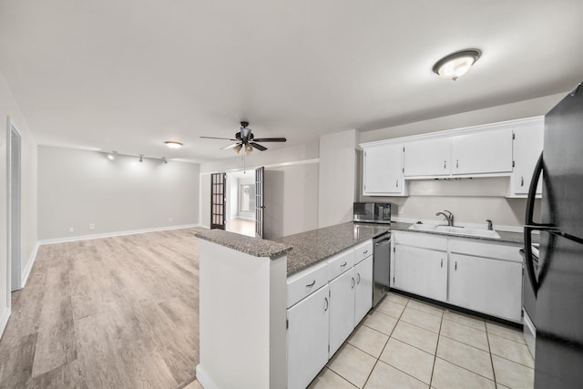 kitchen featuring dishwasher, refrigerator, sink, light wood-type flooring, and white cabinetry