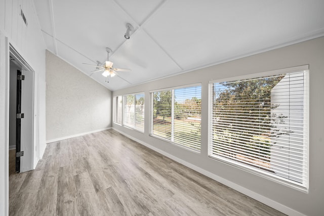 unfurnished sunroom featuring vaulted ceiling and ceiling fan