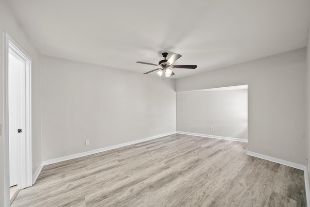 unfurnished room with light wood-type flooring and ceiling fan