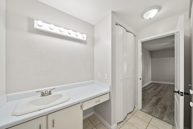 bathroom featuring hardwood / wood-style flooring and vanity